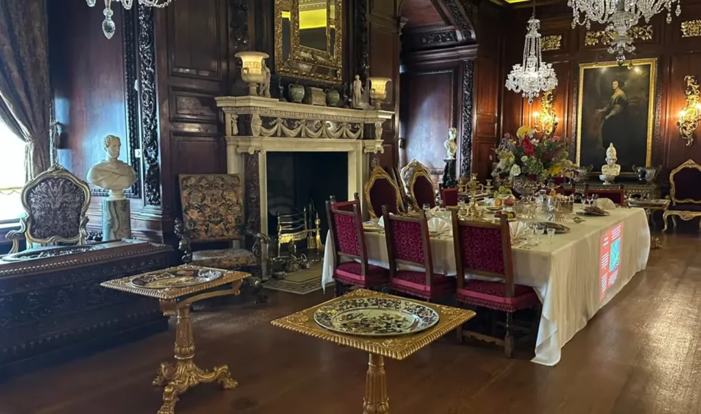 Interior of Warwick Castle showing a formal dining room used by the noble household